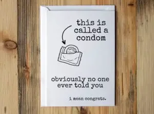 Funny pregnancy card with a condom