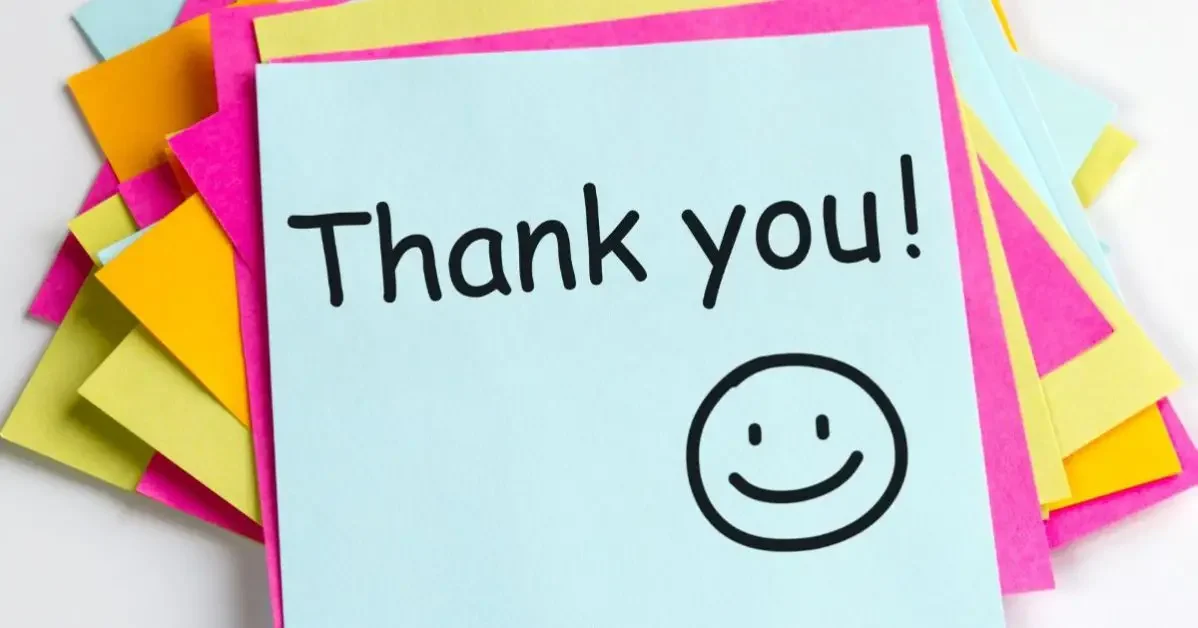 A post it with "thank you" and smiley