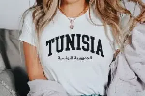 A woman wearing a shirt with "Tunisia"