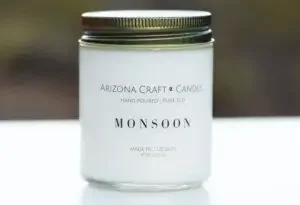 A candle with the label of "Arizona craft, monsoon"