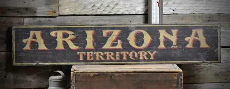 A wooden sign with 'Arizona territory'