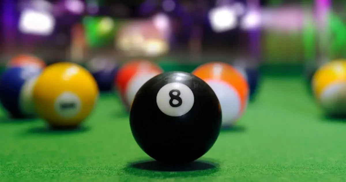 A pool table with a close-up of ball number 8