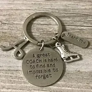 A keychain with a message for an ice skating coach