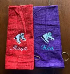 Two skate towels with a personalized name and a pari fo skates