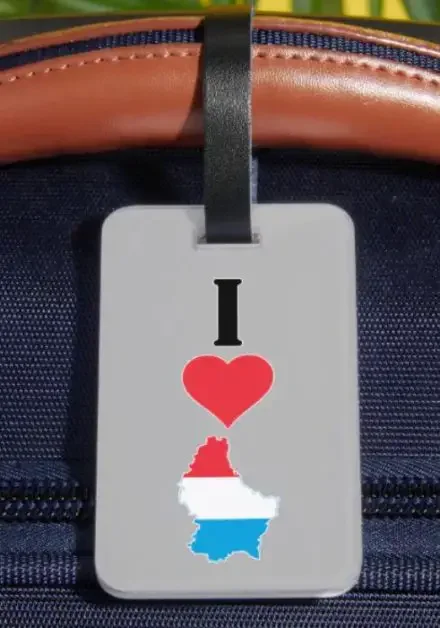 A luggage tag with I love and the map of Luxembourg
