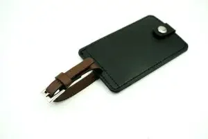A plain black leather luggage tag