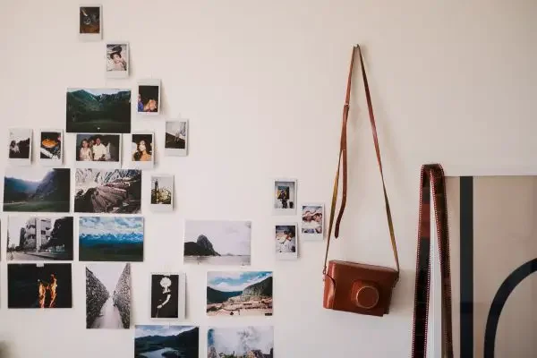 A wall with a photo display