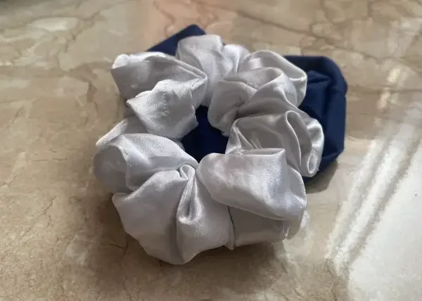 A blue and a white scrunchie