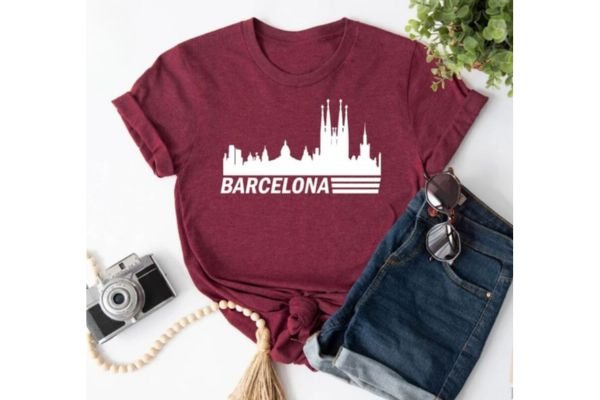 A cherry red shirt with the skyline of Barcelona