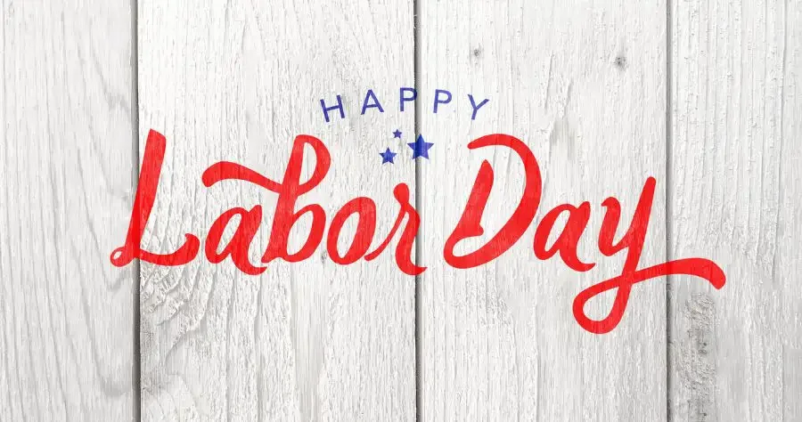 Wooden background with text "happy Labor Day"